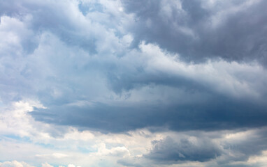 Cloud on blue sky background. Fluffy cumulus white and grey color cloudscape