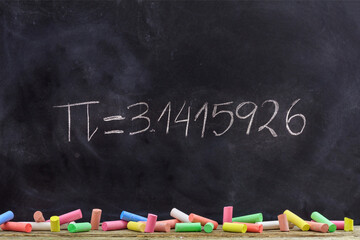 Pi number, mathematical constant chalk drawing on a school black board - obrazy, fototapety, plakaty