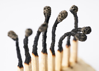 Burnt matches isolated on white. Box of matches. Different stages of match burning Burnt matches. 