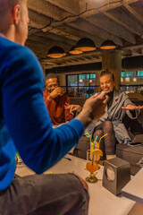 Laughing and trying to explain the word