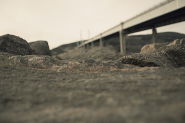 Stones with Bridge in Background