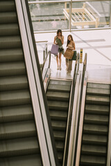 Girls at the escalator