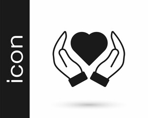 Obraz premium Black Heart in hand icon isolated on white background. Hand giving love symbol. Valentines day symbol. Vector