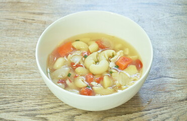boiled macaroni chicken with potato soup on bowl