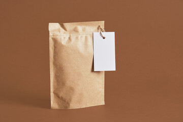 zip craft packaging with white blank mock up tag on brown background