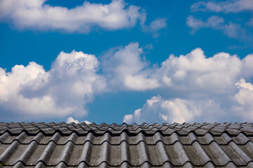 The fluffy cloud in the light blue sky in sunny day. 