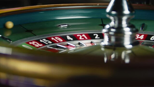 The roulette wheel spins. Selective focus.