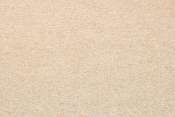 Craft paper texture, a sheet of beige recycled cardboard texture as background