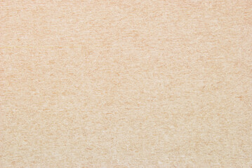 Craft paper texture, a sheet of beige recycled cardboard texture as background