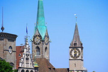 Fototapeta na wymiar Medieval old town of Zürich with church towers of Women's Minster and St. Peter on a sunny hot summer day. Photo taken June 19th, 2022, Zurich, Switzerland.