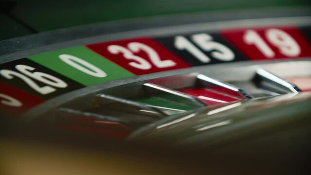 The roulette wheel spins. Selective focus.