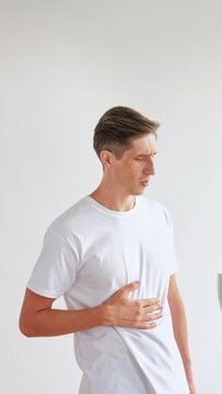 Lazy morning. Tired man. Refreshing coffee. Early wake up. Sleepy thirsty guy getting cup of beverage feeling good isolated on white vertical.