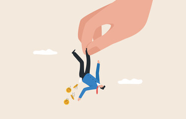 Breaking out of business or investment. Businessman with financial problems. Giant hand holding a businessman hanging upside down.