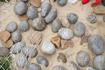 Fototapeta na wymiar Sea pebbles on the beach.Top view. Close up.