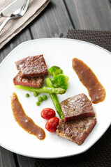 Closeup of fried beef on wooden table