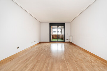Fototapeta na wymiar Empty living room with oak parquet and dark aluminum window leading to open terrace with green floor