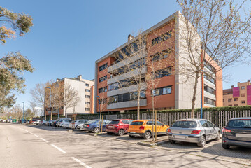 Fototapeta premium Facades of modern urban residential buildings seen from street level