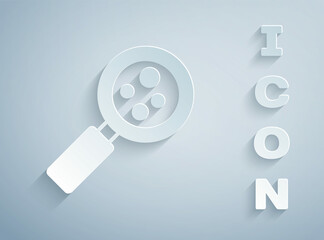 Paper cut Microorganisms under magnifier icon isolated on grey background. Bacteria and germs, cell cancer, microbe, virus, fungi. Paper art style. Vector