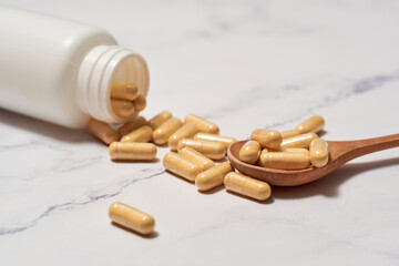Pills of nutritional supplements and probiotics for better digestion.
