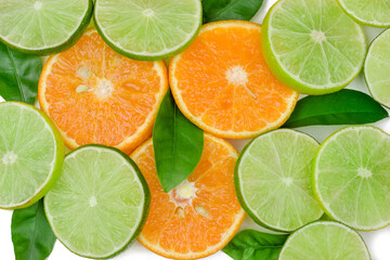 Fototapeta premium The slices of lime and orange isolated on white background