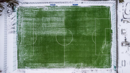 aerial photography top view of the winter football field