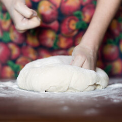 Female hands making dough. Dough kneading process. Dough based on natural sourdough. Wheat dough. Fermentation.	 - obrazy, fototapety, plakaty