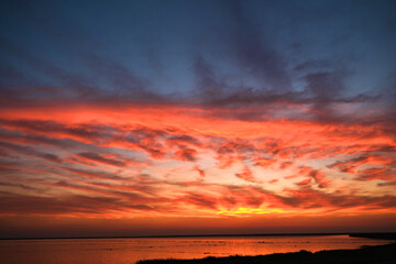 Fototapeta na wymiar Powerful Dramatic Red Sunset Sky