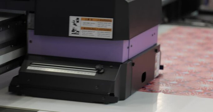 Modern Digital Large format UV printer. Printing production technologies. UV pinning is the process of applying a dose of low intensity ultraviolet light to a UV curable ink
