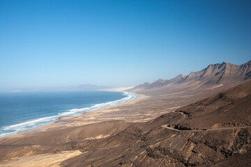 Fototapeta na wymiar View on a volcanic coastline Playa de Cofete Canary Islands 