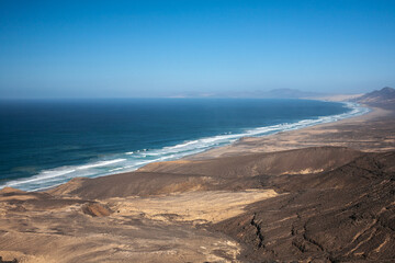 View on a volcanic coastline Playa de Cofete Canary Islands 