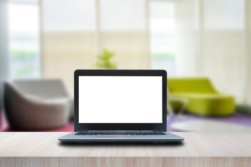 Fototapeta premium Laptop computer blank white screen on table. Reception room. interior of a waiting room, modern office