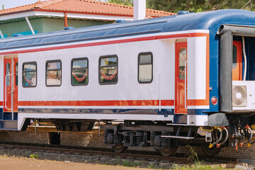 Fototapeta premium A retro tourist carriage of a Turkish train on the station platform. Travel and transport