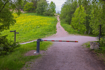 Close up view of barrier to walking path. Green nature backgrounds. Sweden. 