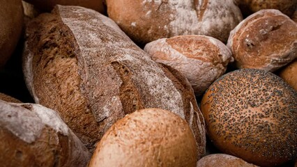 Freshly baked natural bread is on the kitchen table.