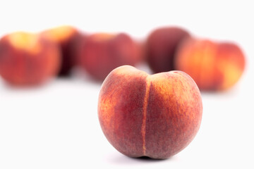 Fresh peaches on bright background. Selective focus.