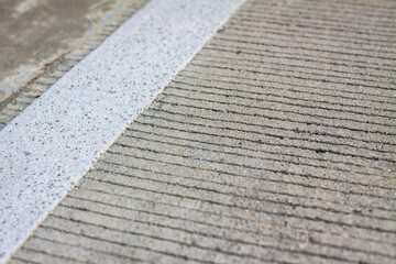 Motor racing circuit Red and White. White and red strip no Parking Sign on Footpath road. Road sign. Red and White sign on road. crosswalk. zebra sign. Pedestrian crosswalk zebra.