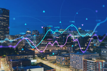 Illuminated aerial cityscape of Seattle, downtown at night time, Washington, USA. Forex graph hologram. The concept of internet trading, brokerage and fundamental analysis