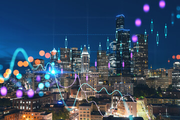 Illuminated aerial cityscape of Seattle, downtown at night time, Washington, USA. Forex graph hologram. The concept of internet trading, brokerage and fundamental analysis