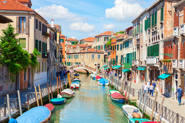 Fototapeta na wymiar View of colorful canal in Venice on sunny morning, Italy.