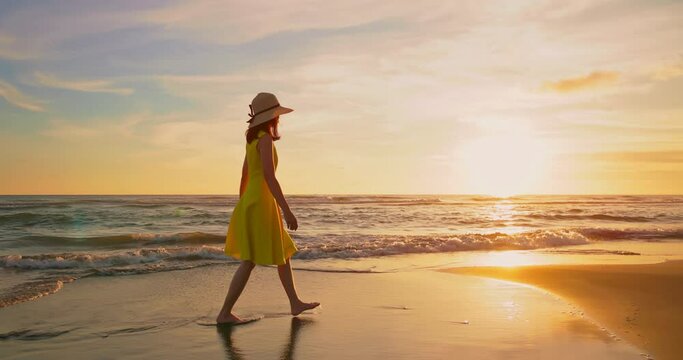 woman walking by beach