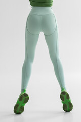 Fitness model in leggings with beautiful buttocks. Sporty booty