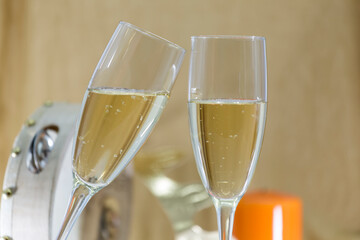 glasses with cava on a golden background