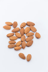 peeled almonds on white background