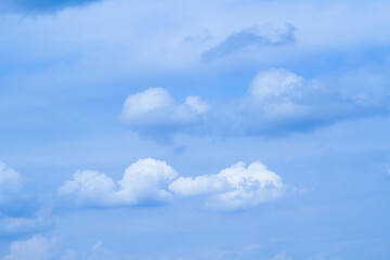 Cumulus clouds. White clouds on a blue background.