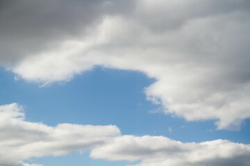 Cumulus clouds. White clouds on a blue background.