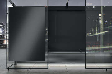 Modern glass bus stop with empty black billboard and reflections on night city background. Mock up, 3D Rendering.
