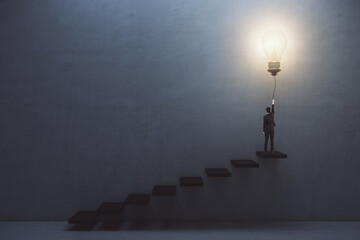 Creative and idea concept with man in suit back view on the top of stairway turning on big light...
