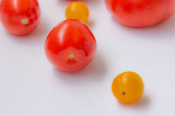 Tomatoes, red tomatoes, yellow tomatoes on white background.