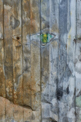 Old metallic wall with peeling paint.