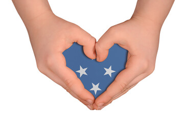 Obraz premium Kid's hands in heart- form. National peace concept on white background. Micronesia